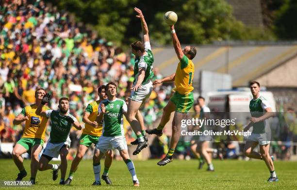 Monaghan , Ireland - 24 June 2018; Michael Murphy of Donegal in action against Eoin Donnelly of Fermanagh during the Ulster GAA Football Senior...