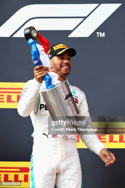 Race winner Lewis Hamilton of Great Britain and Mercedes GP celebrates on the podium during the Formula One Grand Prix of France at Circuit Paul...