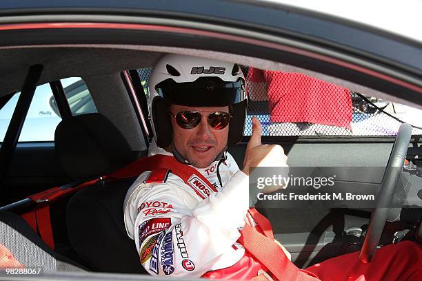 Actor Christian Slater poses for photographers during the press practice day for the Toyota Pro/Celebrity Race on April 6, 2010 in Long Beach,...