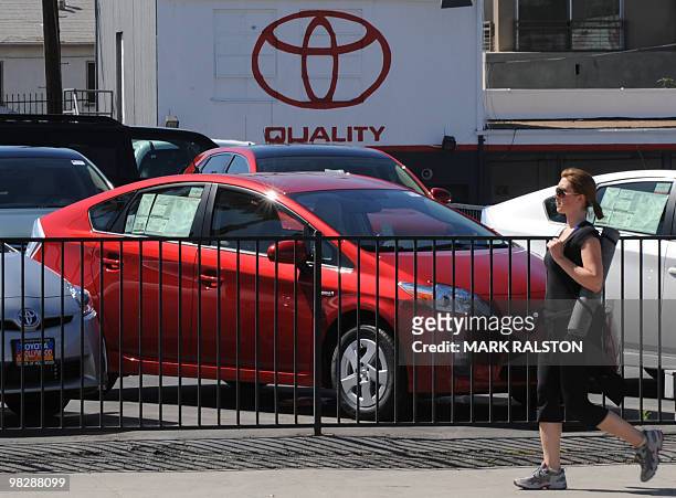 Woman alks past Toyota Prius cars for sale at a Toyota dealer in Hollywood on April 6, 2010. The United States said it was seeking a...