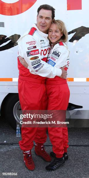 Actor Patrick Warburton and actress Megyn Price pose for photographers during the press practice day for the Toyota Pro/Celebrity Race on April 6,...