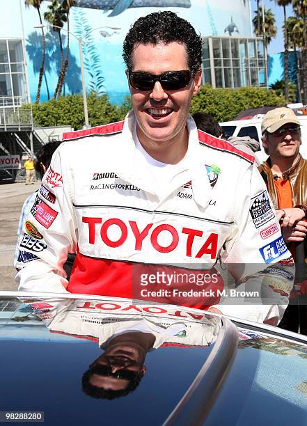Actor Adam Carolla poses for photographers during the press practice day for the Toyota Pro/Celebrity Race on April 6, 2010 in Long Beach, California.