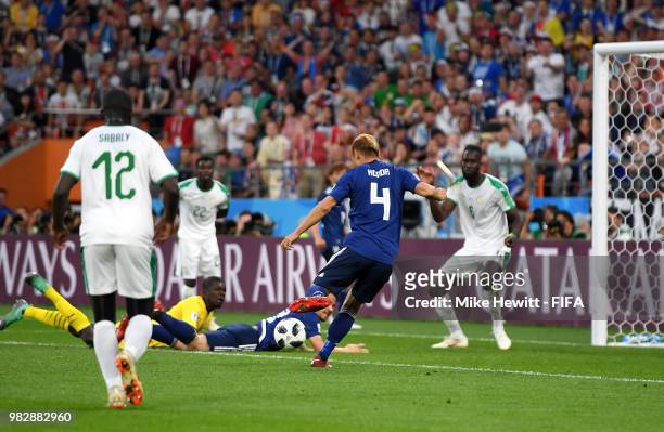 Keisuke Honda of Japan scores his team's second goal during the 2018 FIFA World Cup Russia group H match between Japan and Senegal at Ekaterinburg...