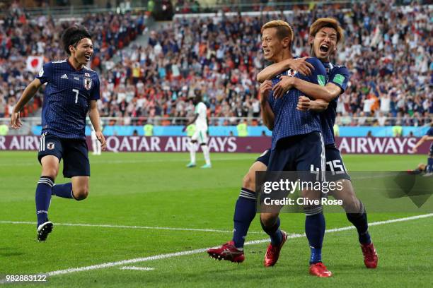 Keisuke Honda of Japan celebrates with teammate Yuya Osako after scoring his team's second goal during the 2018 FIFA World Cup Russia group H match...