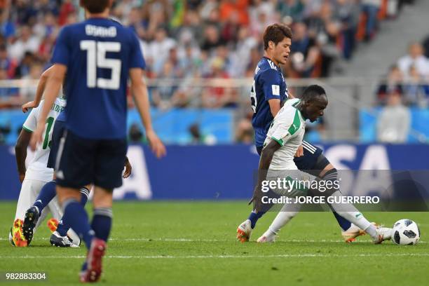 Japan's defender Hiroki Sakai vies with Senegal's midfielder Papa Alioune Ndiaye during the Russia 2018 World Cup Group H football match between...