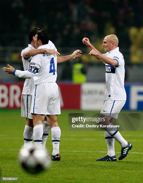 Esteban Cambiasso and Javier Zanetti of FC Internazionale Milano celebrate after their victory over CSKA Moscow in the UEFA Champions League Quarter...