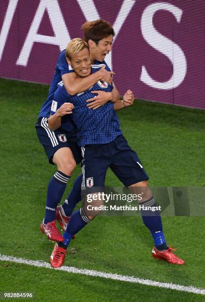 Keisuke Honda of Japan celebrates with teammate Yuya Osako after scoring his team's second goal during the 2018 FIFA World Cup Russia group H match...