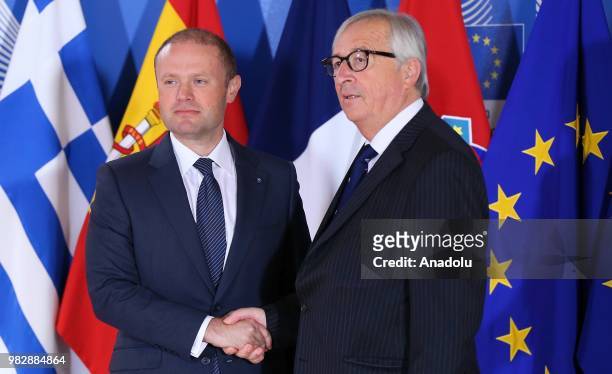 European Commission Chief Jean-Claude Juncker shakes hands with Maltese Prime Minister Joseph Muscat as they attend an informal meeting on migration...
