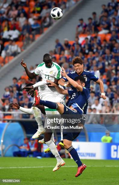 Cheikh Ndoye and Mbaye Niang of Senegal clash with Yuya Osako and Maya Yoshida of Japan during the 2018 FIFA World Cup Russia group H match between...