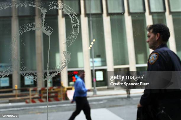 New York City police officer stands on patrol on April 6, 2010 in New York City. Following a melee involving groups of youths around Times Square...