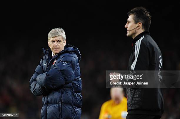 Manager of Arsenal Arsene Wenger looks at an official during the UEFA Champions League quarter final second leg match between Barcelona and Arsenal...