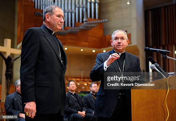 Cardinal Roger Mahony listens as his successor, San Antonio, Texas Archbishop Jose Gomez , during a news conference at the Cathedral of Our Lady of...