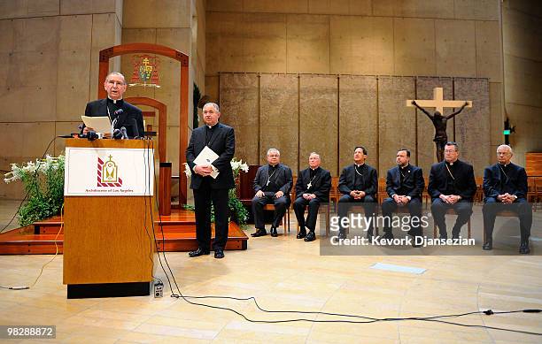 Cardinal Roger Mahony speaks as his successor, San Antonio, Texas Archbishop Jose Gomez , and the bishops listen during a news conference at the...