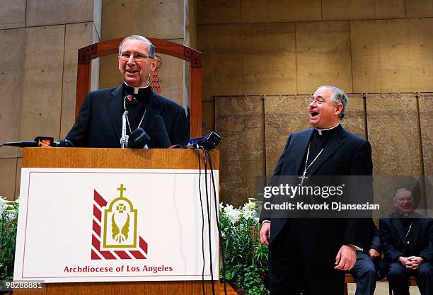 Cardinal Roger Mahony laughs with his successor, San Antonio, Texas Archbishop Jose Gomez , at a news conference at the Cathedral of Our Lady of the...