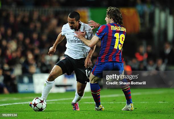 Maxwell of Barcelona challenges Theo Walcott of Arsenal during the UEFA Champions League quarter final second leg match between Barcelona and Arsenal...