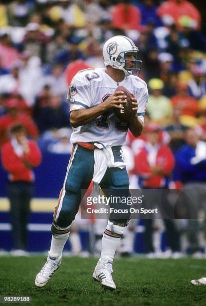Quarterback Dan Marino of the Miami Dolphins drops back to pass circa mid 1990's during an NFL football game. Marino played for the Dolphins from...