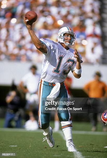 S: Quarterback Dan Marino of the Miami Dolphins throws a pass against the Buffalo Bills circa mid 1990's during an NFL football game at Joe Robbie...