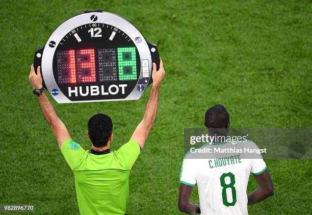 Cheikhou Kouyate of Senegal gests ready to substitute teammate Alfred Ndiaye during the 2018 FIFA World Cup Russia group H match between Japan and...