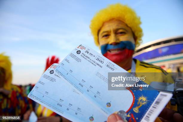 Colombia fan shows their match tickets outside the stadium prior to the 2018 FIFA World Cup Russia group H match between Poland and Colombia at Kazan...