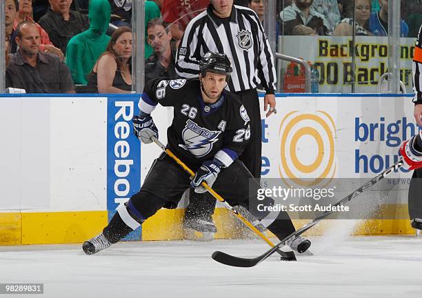 Martin St. Louis of the Tampa Bay Lightning passes the puck against the New York Rangers at the St. Pete Times Forum on April 2, 2010 in Tampa,...