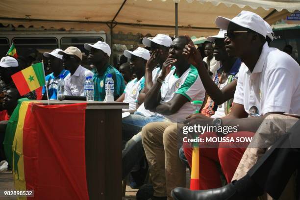 Supporters watch on a giant screen the Russia 2018 World Cup Group H football match between Japan and Senegal on June 24, 2018 in the fan zone in...