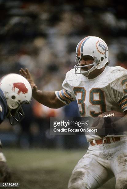 S: Running back Larry Csonka of the Miami Dolphins in action carries the ball against the Buffalo Bills circa early 1970's during an NFL football...
