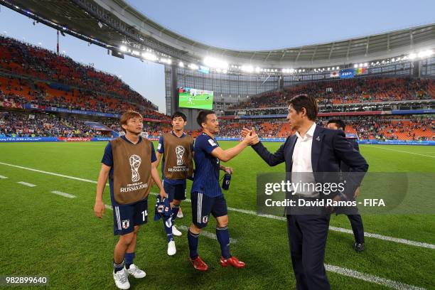 Akira Nishino, Manager of Japan congratulates Shinji Okazaki during the 2018 FIFA World Cup Russia group H match between Japan and Senegal at...