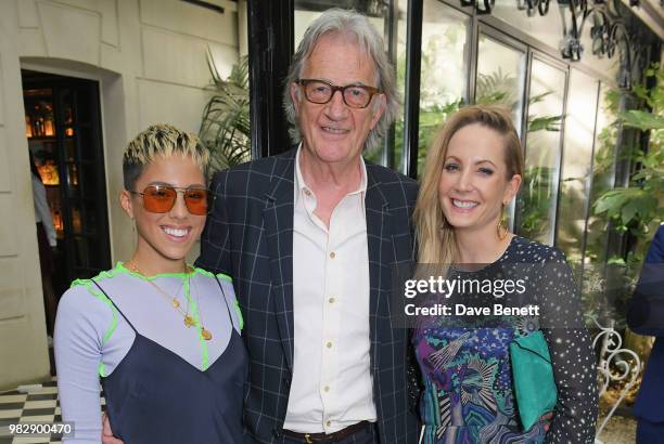 Poppy Ajudha, Sir Paul Smith and Joanne Froggatt, all wearing Paul Smith, attend the Paul Smith SS19 VIP dinner during Paris Fashion Week at Hotel...