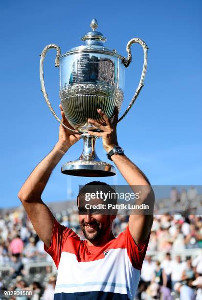 Marin Cilic of Croatia celebrates with the trophy after defeating Novak Djokovic of Serbia in the final of the the Fever-Tree Championships at Queens...