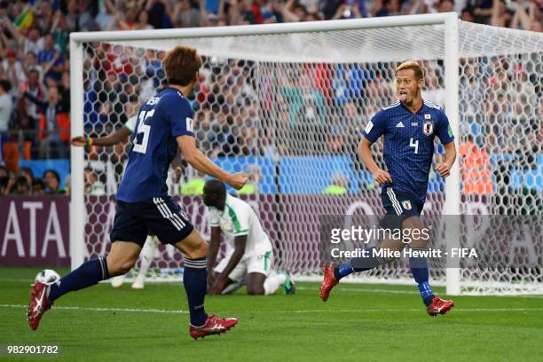 Keisuke Honda of Japan celebrates with teammate Yuya Osako after scoring his team's second goal during the 2018 FIFA World Cup Russia group H match...