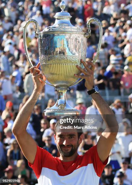 Marin Cilic of Croatia poses with the trophy after his win over Novak Djokovic of Serbia during Day 7 of the Fever-Tree Championships at Queens Club...