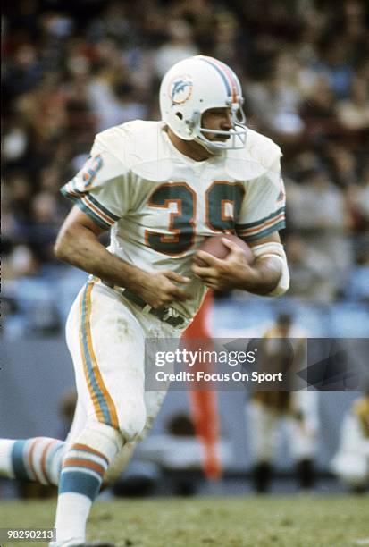 Running back Larry Csonka of the Miami Dolphins in action carries the ball circa mid 1970's during an NFL football game. Csonka played for the...
