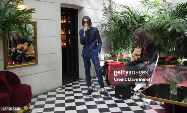 Tom Ogden and Josh Dewhurst of Blossoms perform at the Paul Smith SS19 VIP dinner during Paris Fashion Week at Hotel Particulier Montmartre on June...