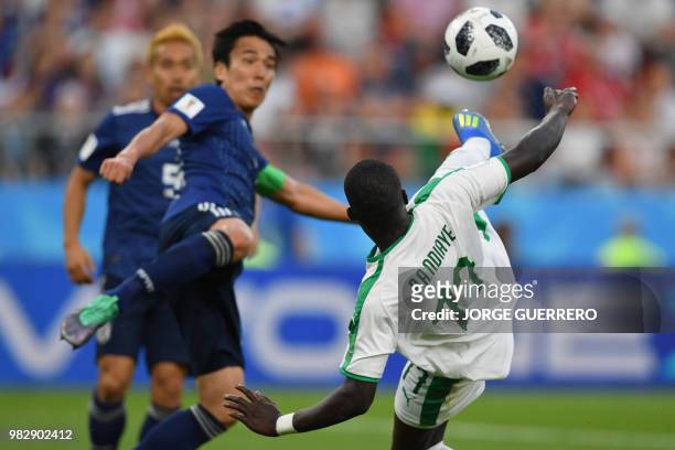 Senegal's midfielder Papa Alioune Ndiaye vies with Japan's midfielder Shinji Kagawa during the Russia 2018 World Cup Group H football match between...