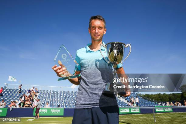 Sergiy Stakhovsky of the Ukraine poses with his trophies after winning the final against Oscar Otte of Germany on day Eight of the Fuzion 100 Ikley...