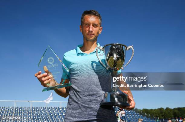 Sergiy Stakhovsky of the Ukraine poses with his trophies after winning the final against Oscar Otte of Germany on day Eight of the Fuzion 100 Ikley...