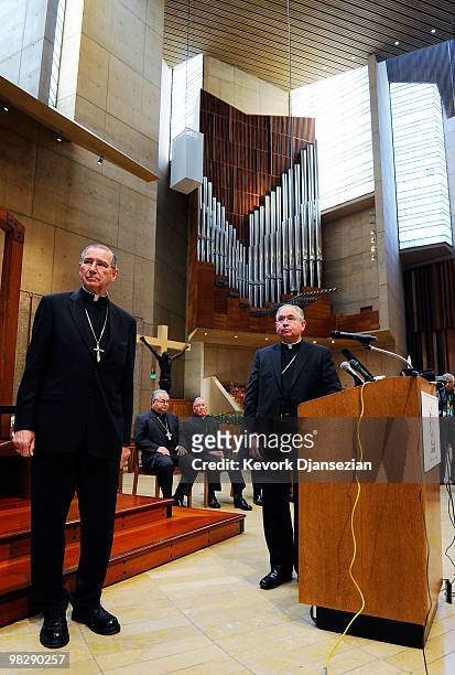Cardinal Roger Mahony listens as his successor, San Antonio, Texas Archbishop Jose Gomez , during a news conference at the Cathedral of Our Lady of...