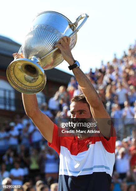 Marin Cilic of Croatia poses with the trophy after his win over Novak Djokovic of Serbia during Day 7 of the Fever-Tree Championships at Queens Club...