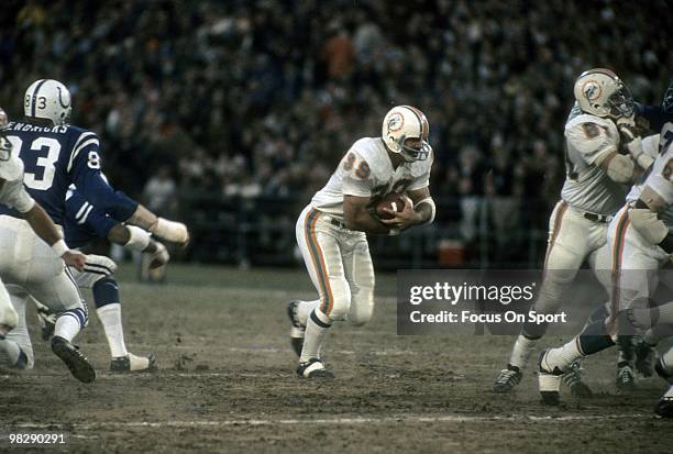 S: Running back Larry Csonka of the Miami Dolphins in action carries the ball against the Baltimore Colts circa mid 1970's during an NFL football...