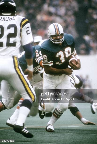 Running back Larry Csonka of the Miami Dolphins with the ball looking to get by defensive back Paul Krause of the Minnesota Vikings January 13, 1974...