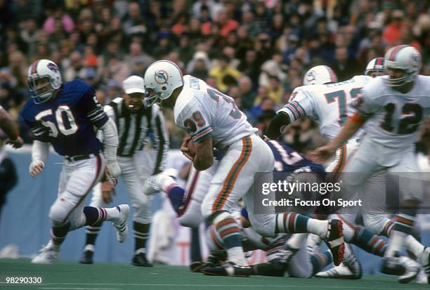 S: Running back Larry Csonka of the Miami Dolphins in action carries the ball against the Buffalo Bills circa mid 1970's during an NFL football game...
