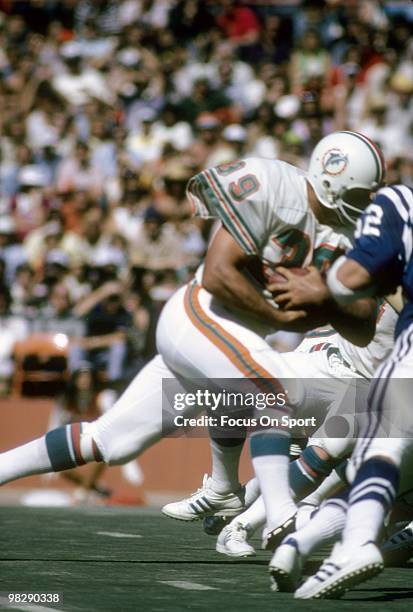 S: Running back Larry Csonka of the Miami Dolphins in action carries the ball against the Baltimore Colts circa mid 1970's during an NFL football...