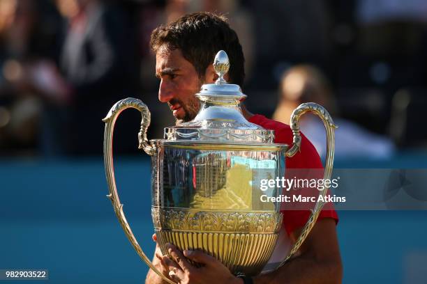 Marin Cilic of Croatia poses with the trophy after his win over Novak Djokovic of Serbia during Day 7 of the Fever-Tree Championships at Queens Club...