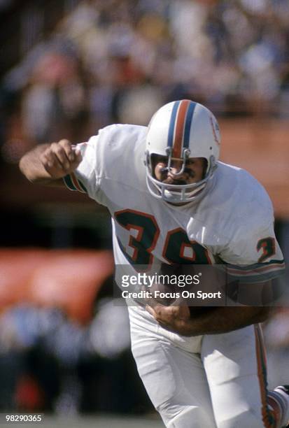 S: Running back Larry Csonka of the Miami Dolphins in action carries the ball circa mid 1970's during an NFL football game at the Orange Bowl in...