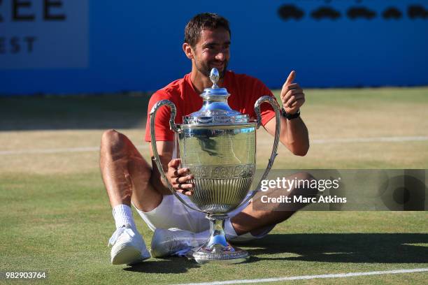 Marin Cilic of Croatia poses with the trophy after his win over Novak Djokovic of Serbia during Day 7 of the Fever-Tree Championships at Queens Club...