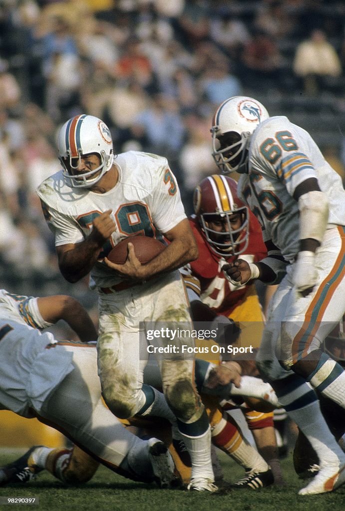 Running back Larry Csonka of the Miami Dolphins carries the ball
