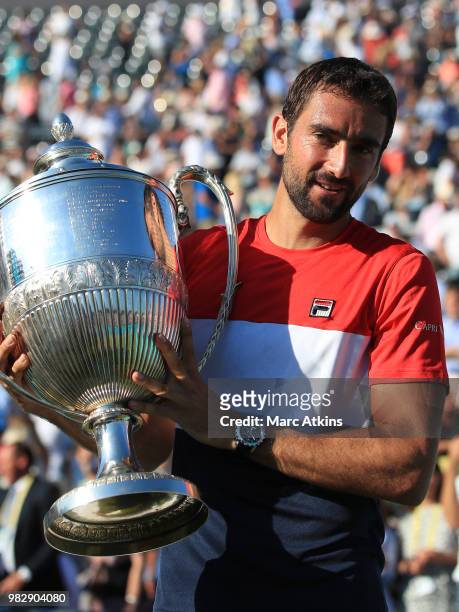 Marin Cilic of Croatia poses with the trophy after his win over Novak Djokovic of Serbia during Day 7 of the Fever-Tree Championships at Queens Club...