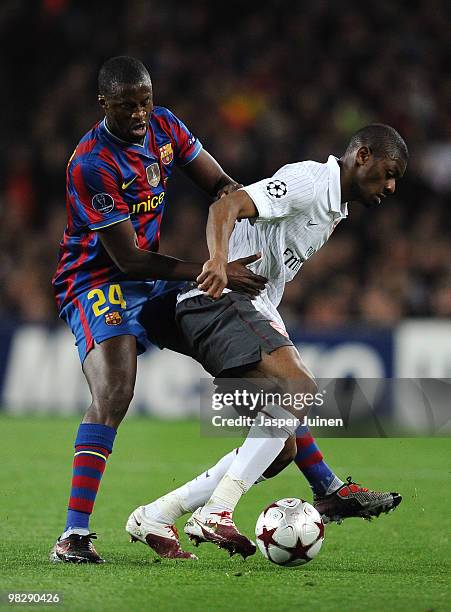 Gnegneri Yaya Toure of Barcelona challenges Abou Diaby of Arsenal during the UEFA Champions League quarter final second leg match between Barcelona...