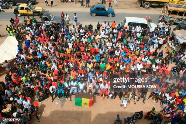 Supporters watch on a giant screen the Russia 2018 World Cup Group H football match between Japan and Senegal on June 24, 2018 in the fan zone in...