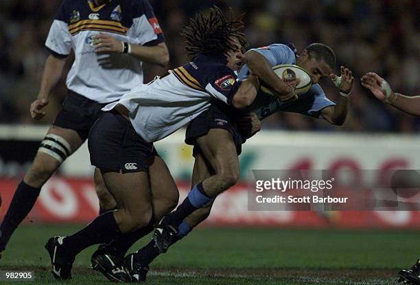 George Smith of the Brumbies tackles Brendan Williams of the Waratahs during the Super 12 match between the ACT Brumbies and the New South Wales...